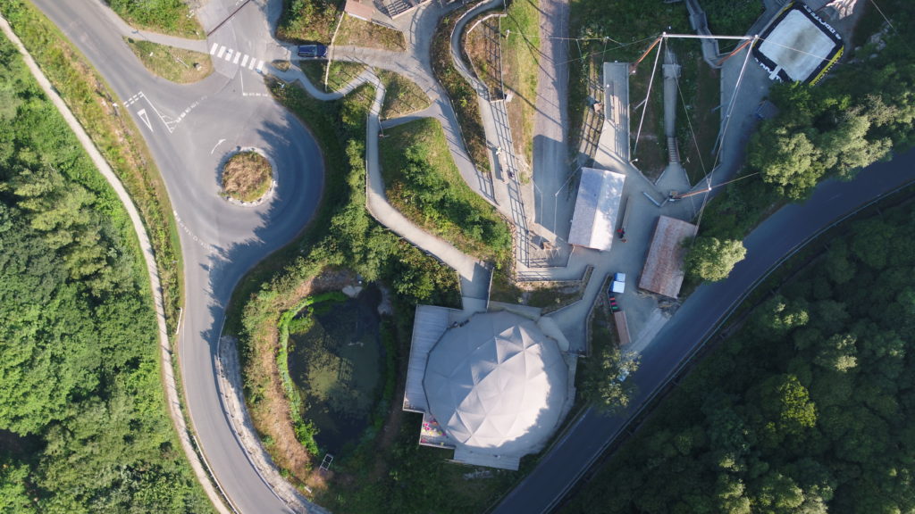 a drone view of an eden project dome
