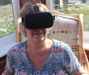a headshot of a woman wearing a VR headset