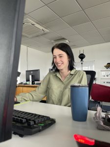 woman looking at computer smiling