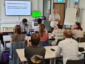 Managing Director Gareth Allen leading a training session in front of the class.