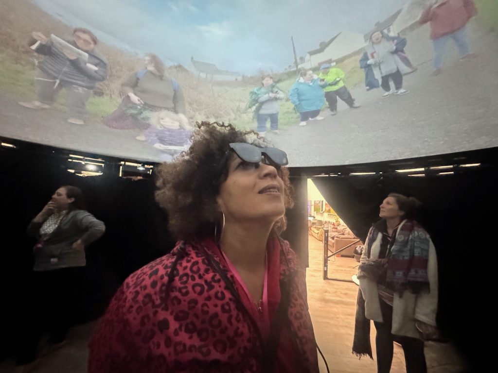 Fulldome production content showing at Fulldome UK in Bristol, with attendees wearing Inclusive Immersive smart glasses