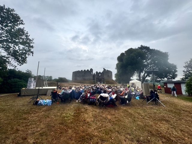 Audience watching the Miracle Theatre Company at Restormel Castle