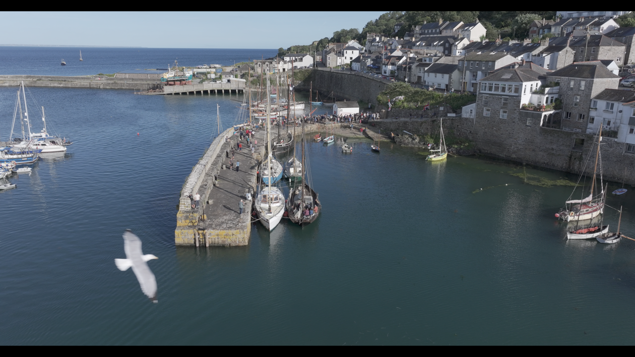 Newlyn Harbor from the air showing the new stone work funded by Historic England