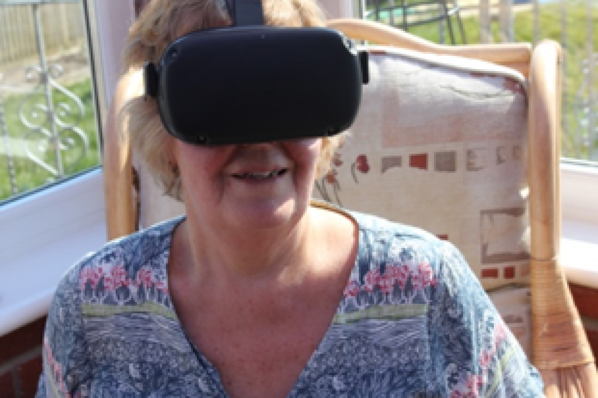 a headshot of a woman wearing a VR headset