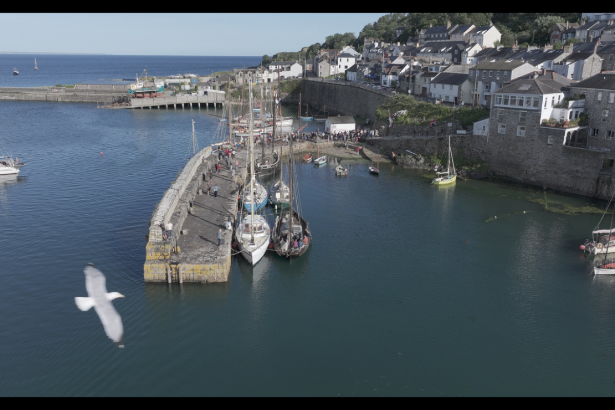 Newlyn Harbor from the air showing the new stone work funded by Historic England